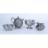 A Selection of Four Near Eastern Silvery Metal Teawares, all embossed and chased with figures,