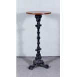 A Late Victorian Pub Table, with wooden circular top, on black painted cast iron column and cast