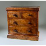 A Victorian Figured Walnut Miniature Chest, of two short over two long drawers, 12.5ins x 5.75ins