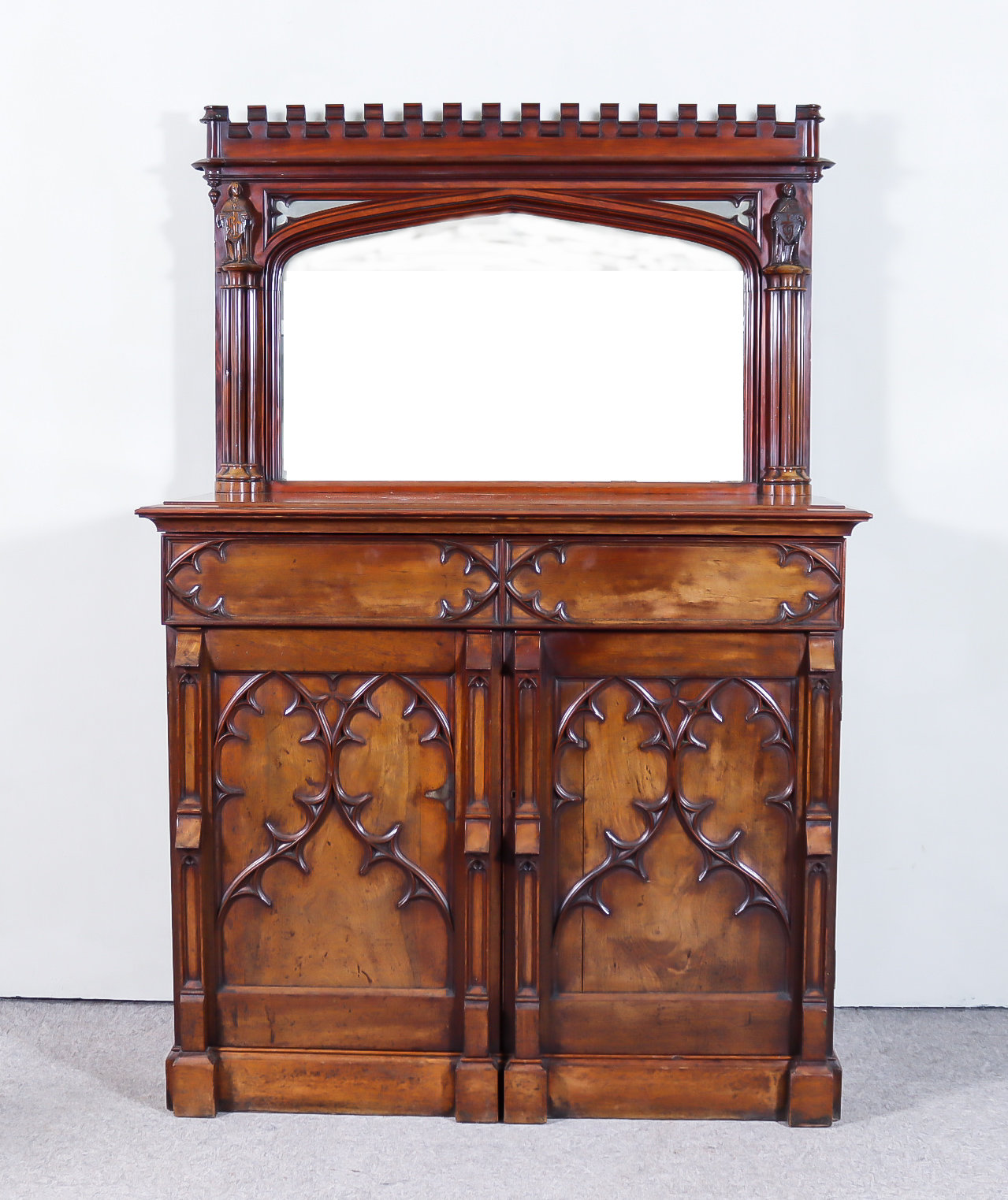 A Victorian Mahogany Gothic Pattern Sideboard, designed by Edward Welby Pugin (1834-1875), for the