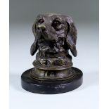 An Austrian Bronze Inkwell, Late 19th Century, modelled as a retriever's head, on polished oval