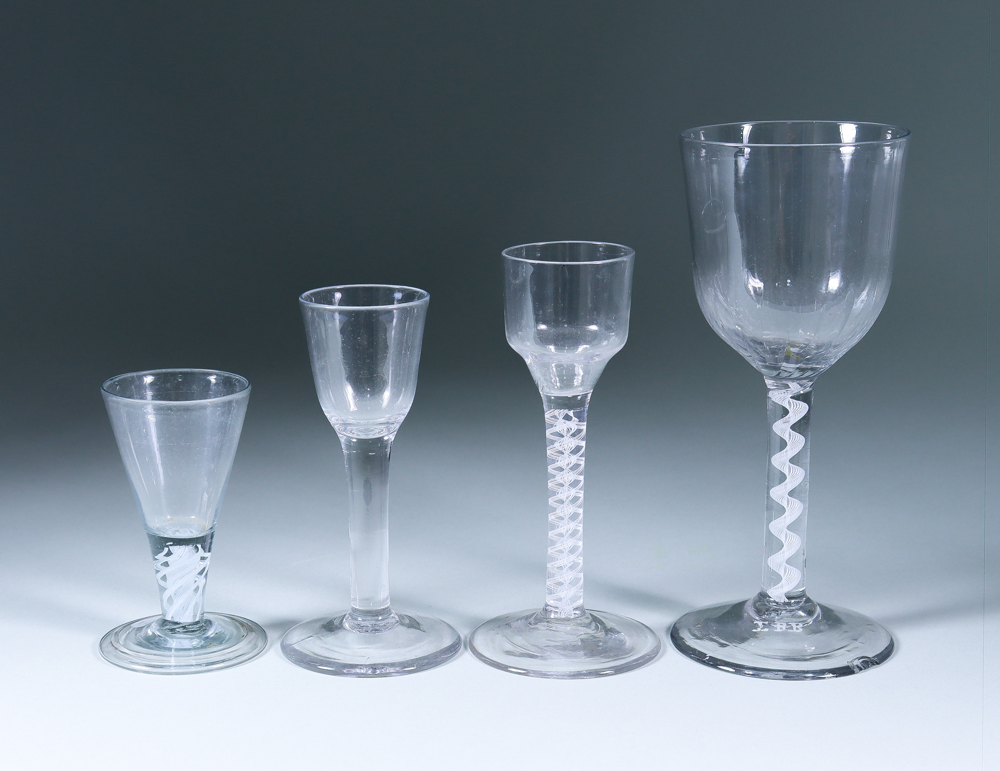 Four Drinking Glasses, 18th Century, including - cordial glass with plain bowl and opaque double