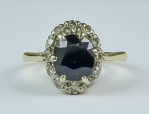 A Sapphire and Diamond Ring, 20th Century, 18ct yellow gold set with a centre sapphire approximately