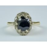 A Sapphire and Diamond Ring, 20th Century, 18ct yellow gold set with a centre sapphire approximately