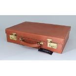 A Tan Leather Attache Case by Simpson of London, unused but slightly shop soiled, 17ins x 12ins,