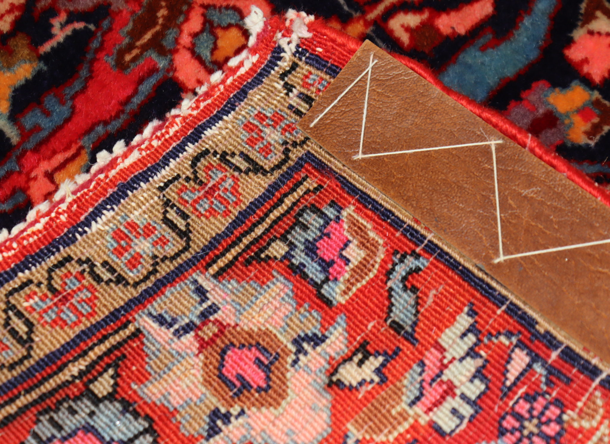 An Early 20th Century Afshar Rug, woven in colours of ivory, navy blue and wine, with central flower - Image 3 of 3