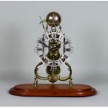 A 20th Century Brass Framed Skeleton Timepiece, the 6.25ins fretted and silvered dial with Roman