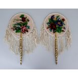 A Pair of Women's Face Shields, Late 19th Century, of embroidered canvas with chenille floral design