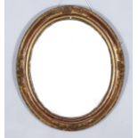 A 19th Century Gilt Framed Oval Wall Mirror, the moulded frame with floral and leaf scroll carvings,