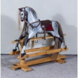 An Early 20th Century Dapple Grey Children's Rocking Horse made by G.J. Lines, on turned pine