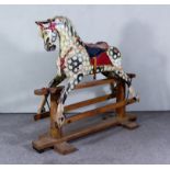 An Early 20th Century Dapple Grey Painted Rocking Horse, by Collinson, on pine stand, 55ins wide x