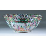 A Chinese Cantonese Porcelain Punchbowl, 19th Century, enamelled in colours with alternating