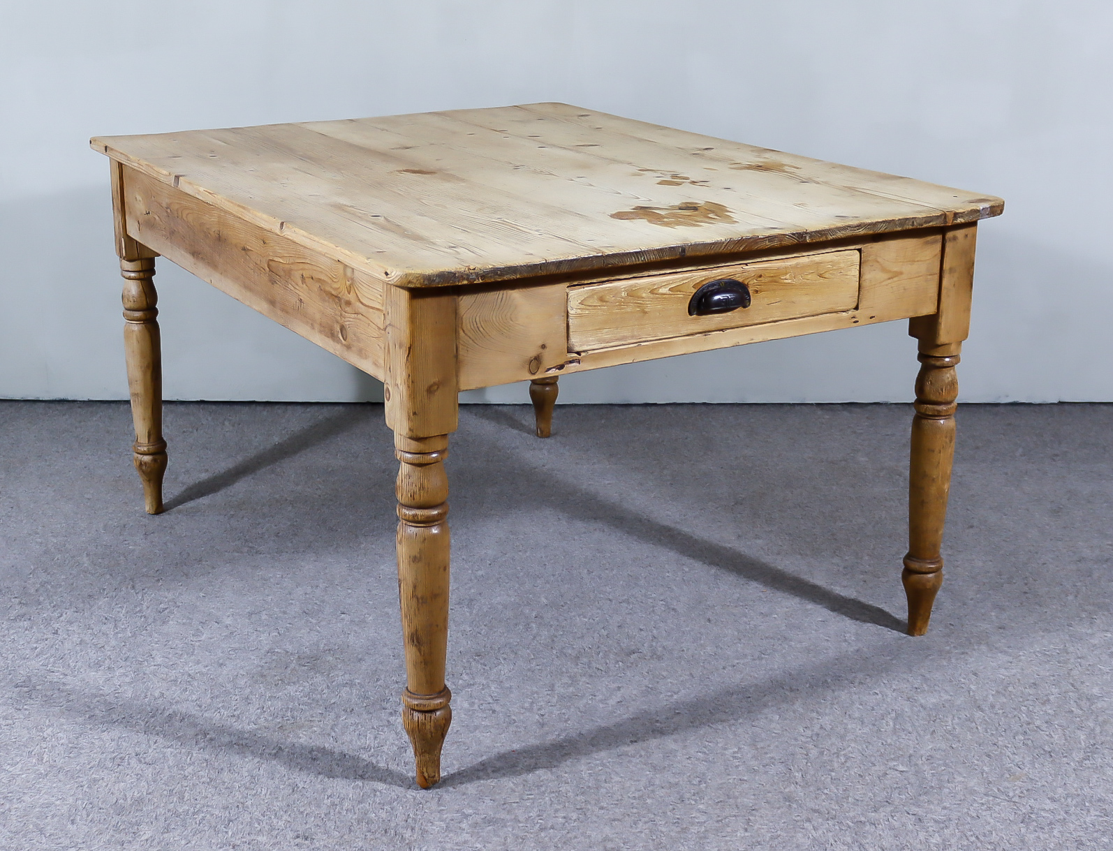 A Victorian Stripped Pine Rectangular Kitchen Table, with four plank top, fitted one front drawer,