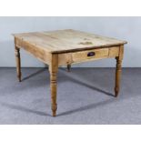 A Victorian Stripped Pine Rectangular Kitchen Table, with four plank top, fitted one front drawer,