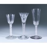 Three Wine Glasses, 18th Century, including - wine glass with engraved trumpet bowl on an opaque