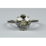 A Solitaire Diamond Ring, Modern, in white metal mount, set with a round brilliant cut diamond,