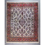 An Early 20th Century Kirman Carpet, woven in pastel colours with a central lozenge shaped