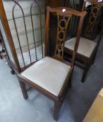 A SET OF FOUR MAHOGANY DINING CHAIRS WITH PIERCED SPLAT BACKS, DROP-IN SEATS, ON STRAIGHT FRONT