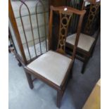 A SET OF FOUR MAHOGANY DINING CHAIRS WITH PIERCED SPLAT BACKS, DROP-IN SEATS, ON STRAIGHT FRONT