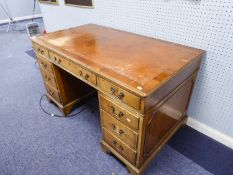 A MODERN YEWWOOD TWIN PEDESTAL DESK, EACH PEDESTAL HAVING FOUR DRAWERS