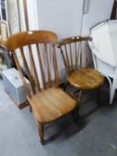 AN OAK NURSING CHAIR AND A SPINDLE BACK DINING  CHAIR WITH CIRCULAR SEAT (2)