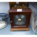 A MODERN MAHOGANY BRACKET CLOCK WITH STRIKING MOVEMENT, SQUARE BRASS AND SILVERED DIAL, BRASS