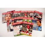 FOURTEEN ENGLAND HOME PROGRAMMES PLAYED AT OLD TRAFFORD, to include Spain, Poland, Greece, etc.