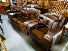 ART DECO PERIOD SEMI-WINGED LOUNGE SUITE OF THREE PIECES, COVERED IN BROWN HID WITH WALNUT WOOD