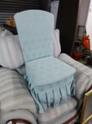 AN ARMLESS BOUDOIR EASY CHAIR, IN PALE BLUE FABRIC, THE BOX SEAT WITH LIFT-UP LID