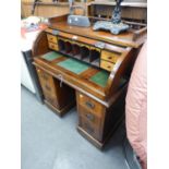 A SMALL  ROLL-TOP DESK, HAVING DOMED ROLLER SHUTTER GALLERY TOP WITH FITTED INTERIOR, RAISED ON TWIN