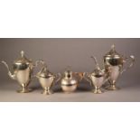 FOUR PIECE ELECTROPLATED PEDESTAL TEA AND COFFEE SET, of ovoid form with scroll handles and flame