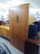 AN OAK SEMI FITTED TWO DOOR WARDROBE (A.F.), AND AN OAK SIDEBOARD HAVING CUPBOARD DOORS, THREE