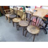 FOUR SPINDLE BACK CHAIRS WITH CIRCULAR SEATS AND A WINDSOR ARMCHAIR (BACK CUT DOWN) (5)