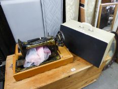 AN ELECTRIC PORTABLE SEWING MACHINE