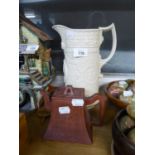 A GREY EMBOSSED POTTERY TALL JUG; A RED WARE TAPERED RECTANGULAR TEAPOT
