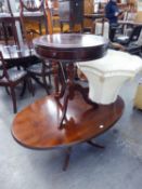 A REGENCY STYLE MAHOGANY OVAL OCCASIONAL TABLE, ON QUARTETTE SUPPORTS AND A CIRCULAR DRUM TOP