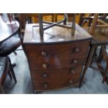 AN ANTIQUE MAHOGANY COMMODE WITH FOUR FALSE DRAWERS AND BOWED FRONT