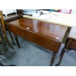 A MAHOGANY PEMBROKE TABLE WITH FALL-LEAVES, RAISED ON TURNED SUPPORTS