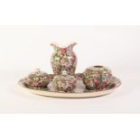 FOUR PIECE CROWN DUCAL FLORAL PRINTED POTTERY DRESSING TABLE SET AND THE MATCHING OVAL TRAY,