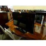 A SAMSUNG 32" TV WITH REMOTE CONTROL