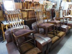 A SET OF FOUR JACOBEAN STYLE CARVED OAK RAIL BACK DINING CHAIRS