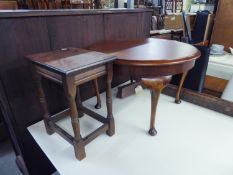 A CIRCULAR OAK COFFEE TABLE  AND A SMALL OBLONG WINE TABLE (2)