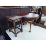 A CIRCULAR OAK COFFEE TABLE  AND A SMALL OBLONG WINE TABLE (2)