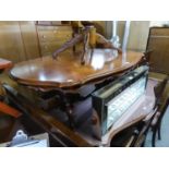 ITALIAN WALNUT AND MARQUETRY SHAPED OVAL COFFEE TABLE, ON TWO COLUMNS, EACH WITH TWO SWEPT SUPPORTS,