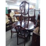 REGENCY STYLE MAHOGANY CIRCULAR DINING TABLE, ON COLUMN AND QUARTETTE SUPPORTS, EXTENDING WITH A