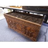 AN AFRICAN CARVED WOOD BEDDING BOX (HINGED TOP LOOSE)