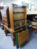 AN OAK SMALL BOOKCASE WITH GLASS SLIDING DOORS AND A FOLDING CARD TABLE AND TWO FOLD-AWAY TABLES (4)