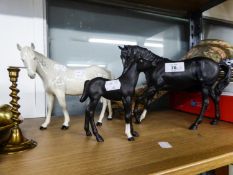 A ROYAL DOULTON GREY HORSE, A SIMILAR BROWN HORSE AND A ROYAL DOULTON FOAL (3)