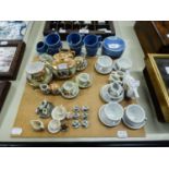 FIVE CERAMIC DOLLS TEA SETS OR PART SETS AND A CHINA DOLLS HOUSE MINIATURE TEA SET OF 15 PIECES