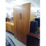 AN OAK SEMI FITTED TWO DOOR WARDROBE (A.F.), AND AN OAK SIDEBOARD HAVING CUPBOARD DOORS, THREE